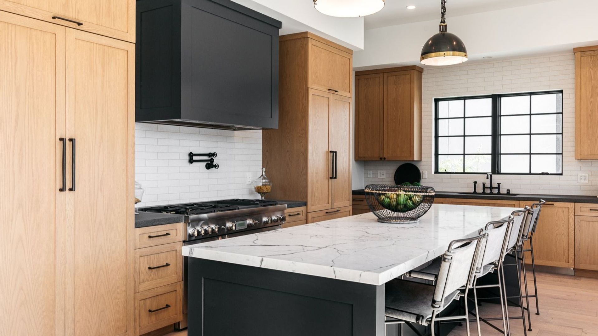 Organized modern and warm kitchen and bathroom with natural wood tones and hidden storage – 2025 home design trends